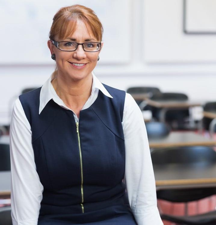Portrait of a smiling female teacher in the class room