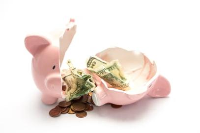 Hocking College - Tuition and Fees | Piggy bank broken with money inside on white background
